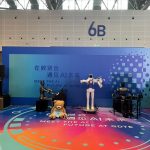 Humanoid robot band at digital trade expo, from virtual AI algorithm to real-world physical robot application